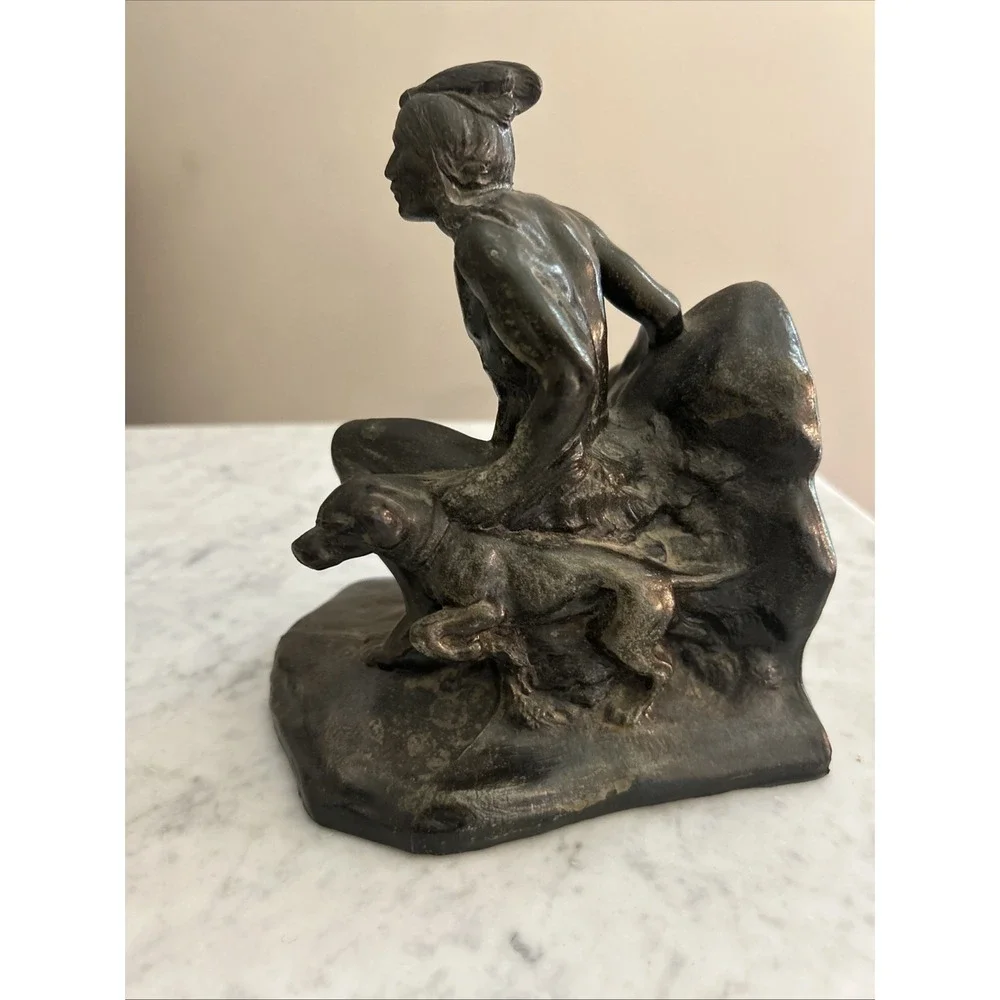 Antique Meal metal cast Indian bookends. Good condition.